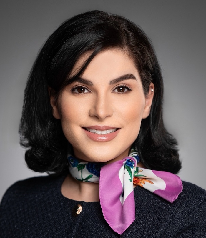 Tanya Aghazadeh, SFSU graduate student in MS in Business Analytics program. Woman with shoulder-length dar hair, wearing floral scarf and dark top